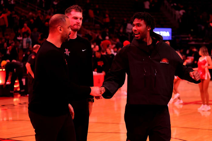 Rockets head coach Ime Udoka and Houston Rockets forward Tari Eason (17) leave the court following the game against the Brooklyn Nets at Toyota Center.